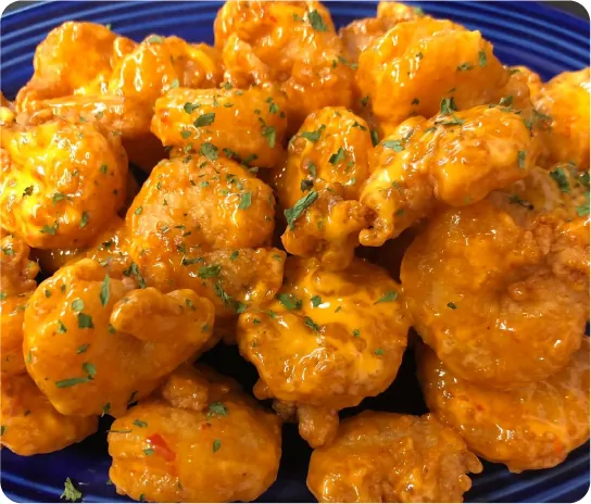 photo appetizing grilled shrimps with sauce.